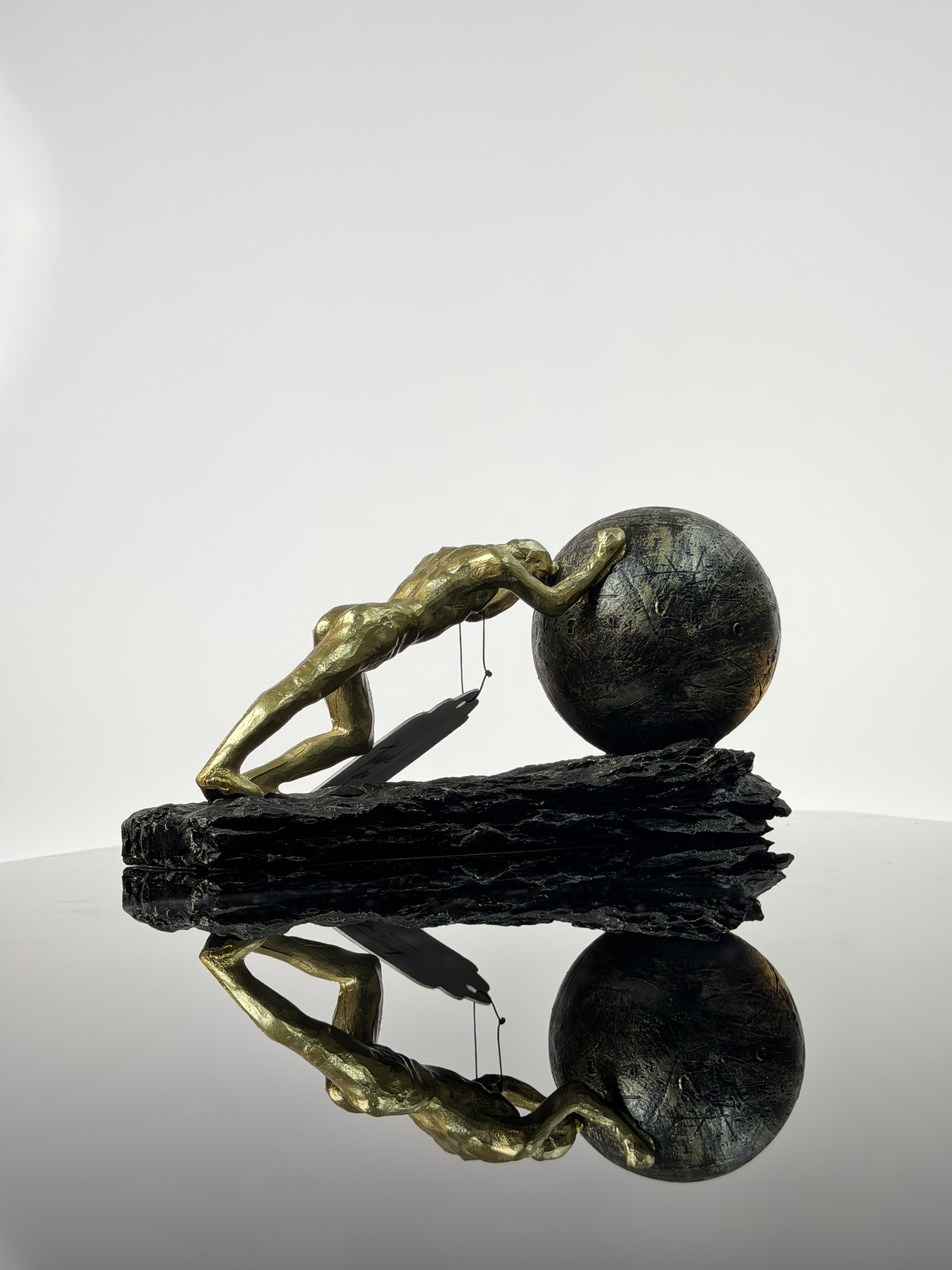 Sisyphus Sculpture (Man Pushing Sphere)